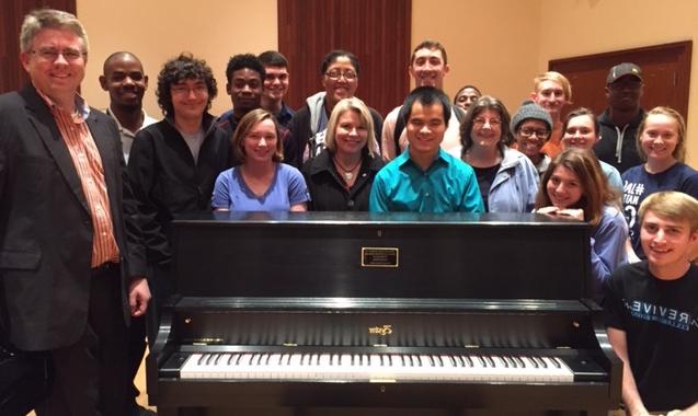 Students with Newly Donated Piano for Practice Rooms