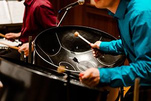 Student playng a percussion instrument.